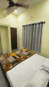 Letto o letti in una camera di Mysuru-hotel