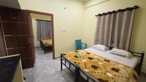 Letto o letti in una camera di Mysuru-hotel