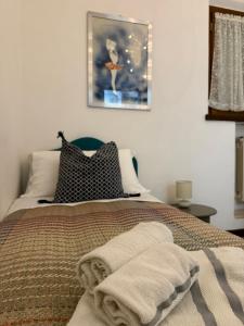 Łóżko lub łóżka w pokoju w obiekcie Chianciano Lettings