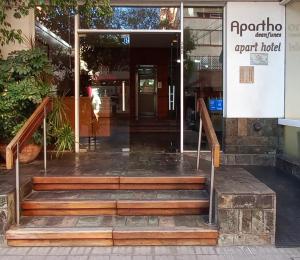 an entrance to a building with wooden stairs in front at Apartho Dean Funes in Salta