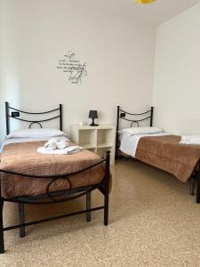 Łóżko lub łóżka w pokoju w obiekcie Chianciano Lettings
