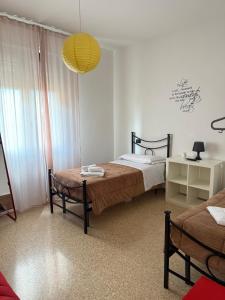 Łóżko lub łóżka w pokoju w obiekcie Chianciano Lettings