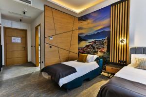 Postel nebo postele na pokoji v ubytování Hotel Boka