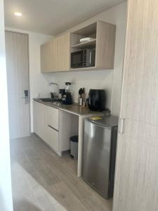 a kitchen with a sink and a counter top at Usaquén Vida & Cultura suite in Bogotá