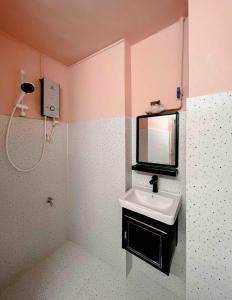 a bathroom with a sink and a mirror at Glorious CENTRAL Loft - Near BenThanh Market - Walk to METRO in Ho Chi Minh City