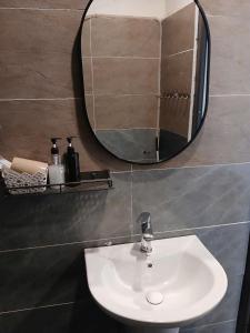 a bathroom with a sink and a mirror at Catba Papillon Garden Bungalows & Resort in Cat Ba