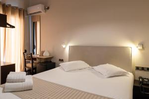 Postel nebo postele na pokoji v ubytování Plaza Hotel