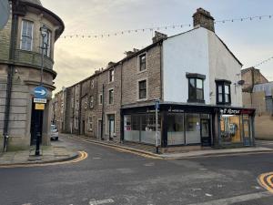 an old building on a city street with at The Penthouse, Barnoldswick in Barnoldswick