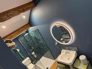an overhead view of a bathroom with a mirror and a sink at The Penthouse, Barnoldswick in Barnoldswick +12 photos