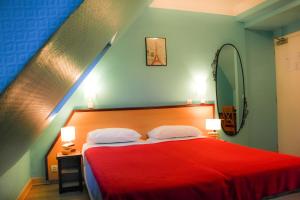 Postel nebo postele na pokoji v ubytování Hotel Audran