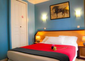 Postel nebo postele na pokoji v ubytování Hotel Audran