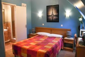 Postel nebo postele na pokoji v ubytování Hotel Audran