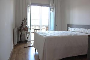 Postel nebo postele na pokoji v ubytování Hostal Siglo XIX