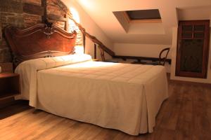 Postel nebo postele na pokoji v ubytování Hostal Siglo XIX
