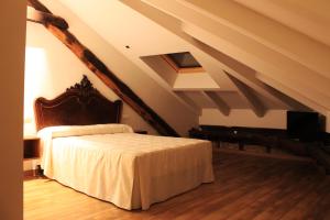 Postel nebo postele na pokoji v ubytování Hostal Siglo XIX