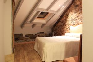Postel nebo postele na pokoji v ubytování Hostal Siglo XIX