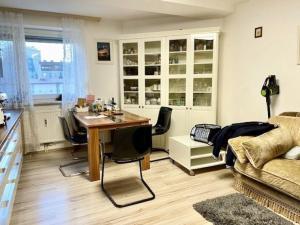 a living room with a table and a couch at EPT Apartments in Schwyz