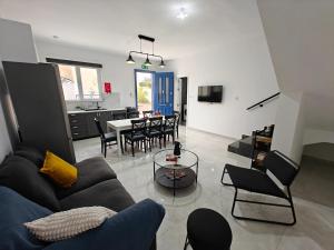 a living room with a couch and a table at Spacious Central Apartment in Rabat