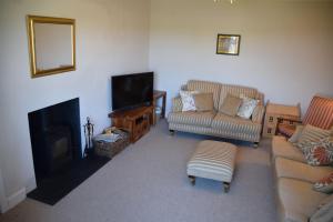 Zona de estar de Albany Cottage