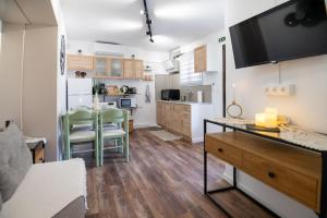 a kitchen with a table and a dining room at Stoa House in Mourné