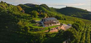 an aerial view of a house on a hill at Sorapiana in Vidor