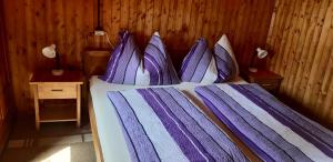 A bed or beds in a room at Platzerhütte