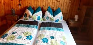 A bed or beds in a room at Platzerhütte