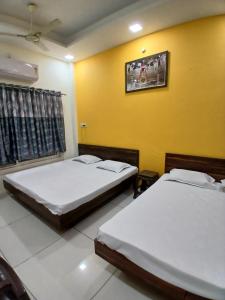 Katil atau katil-katil dalam bilik di OM SHANTI Home Stay