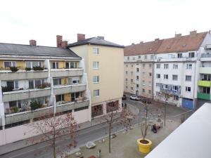 an aerial view of a city with buildings at Wien Schwechat Apartment Airport in Schwechat