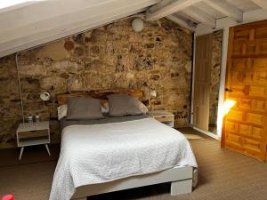 A bed or beds in a room at La Milana, Orbaneja del Castillo
