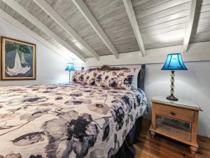 A bed or beds in a room at Chrisanns Paradise Suite by the Ocean - Apt#9