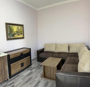 a living room with a couch and a table at Konak in Gabala