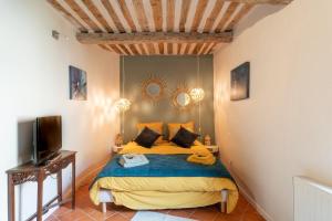 Ένα ή περισσότερα κρεβάτια σε δωμάτιο στο Gite La Confidence