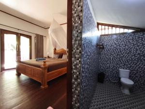 Ένα μπάνιο στο Matahari Bungalow 3