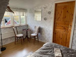 Postel nebo postele na pokoji v ubytování Sanddala Bed & Breakfast
