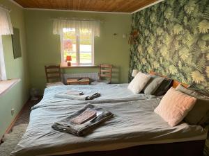 Postel nebo postele na pokoji v ubytování Sanddala Bed & Breakfast
