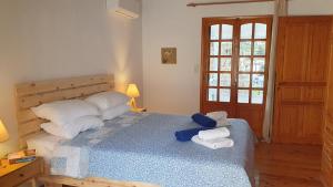 Postel nebo postele na pokoji v ubytování Villa Leonidas just enjoy your holidays