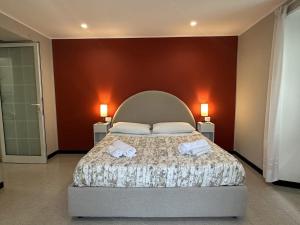 a bedroom with a bed with two towels on it at Bellavita,Como in Como