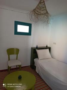 Postel nebo postele na pokoji v ubytování Riad rajad Marrakech