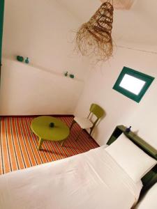 Postel nebo postele na pokoji v ubytování Riad rajad Marrakech