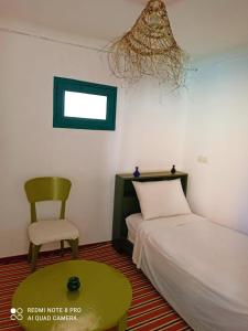 Postel nebo postele na pokoji v ubytování Riad rajad Marrakech