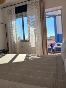 Postel nebo postele na pokoji v ubytování Hotel Al Manar