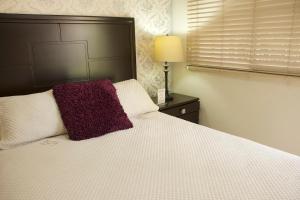 Ένα ή περισσότερα κρεβάτια σε δωμάτιο στο El Jardin de la Nonna