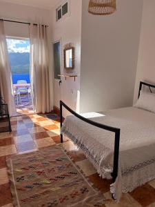 Postel nebo postele na pokoji v ubytování Hotel Al Manar