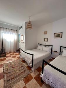 Postel nebo postele na pokoji v ubytování Hotel Al Manar