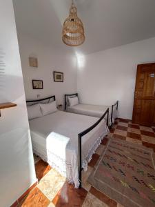 Postel nebo postele na pokoji v ubytování Hotel Al Manar