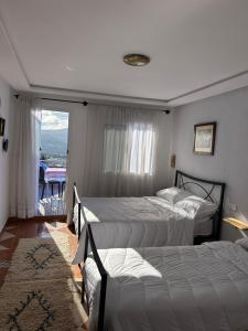 Postel nebo postele na pokoji v ubytování Hotel Al Manar
