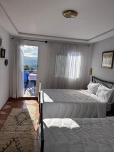 Postel nebo postele na pokoji v ubytování Hotel Al Manar