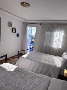 Postel nebo postele na pokoji v ubytování Hotel Al Manar