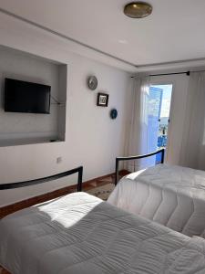 Postel nebo postele na pokoji v ubytování Hotel Al Manar